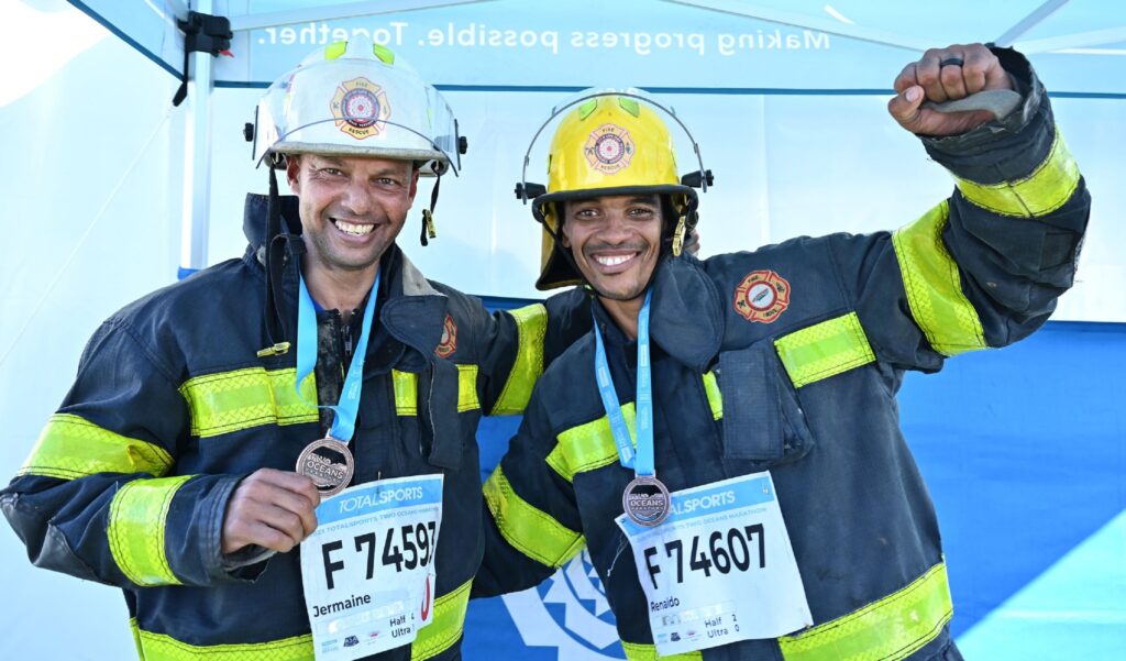 Firefighters Jermaine-and-Renaldo with their medals-after-successfully-completing-the-race-in 2023