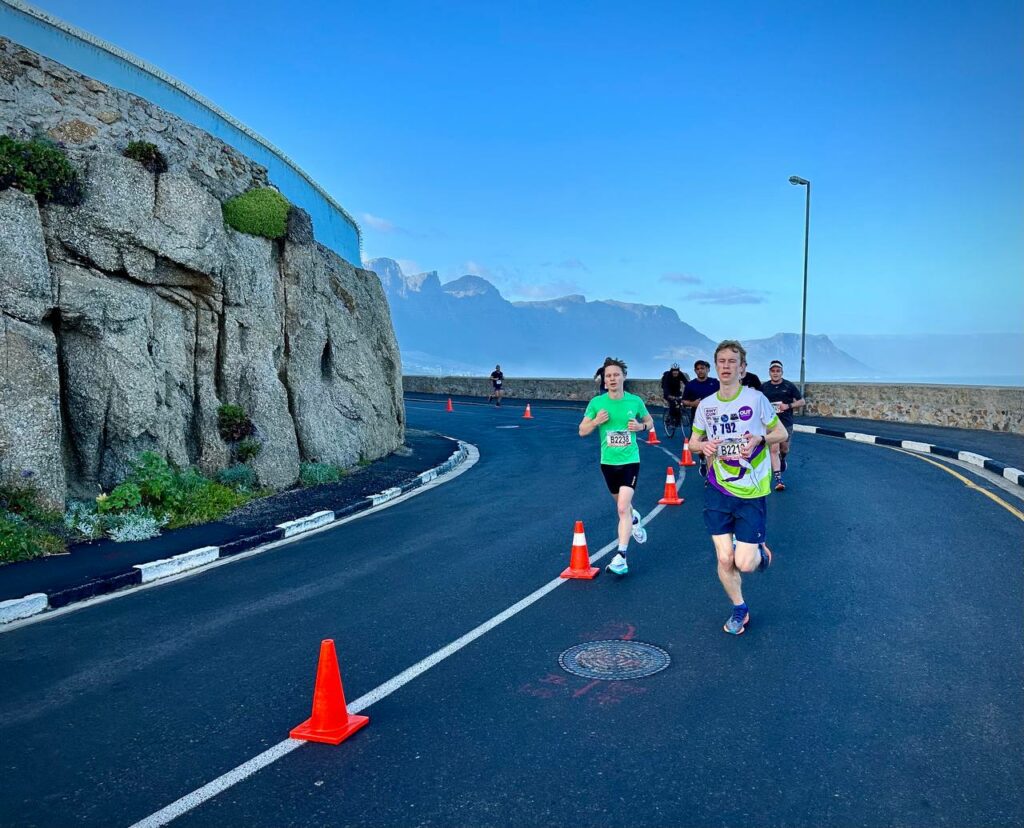 Man and Woman running on road in Cape Town