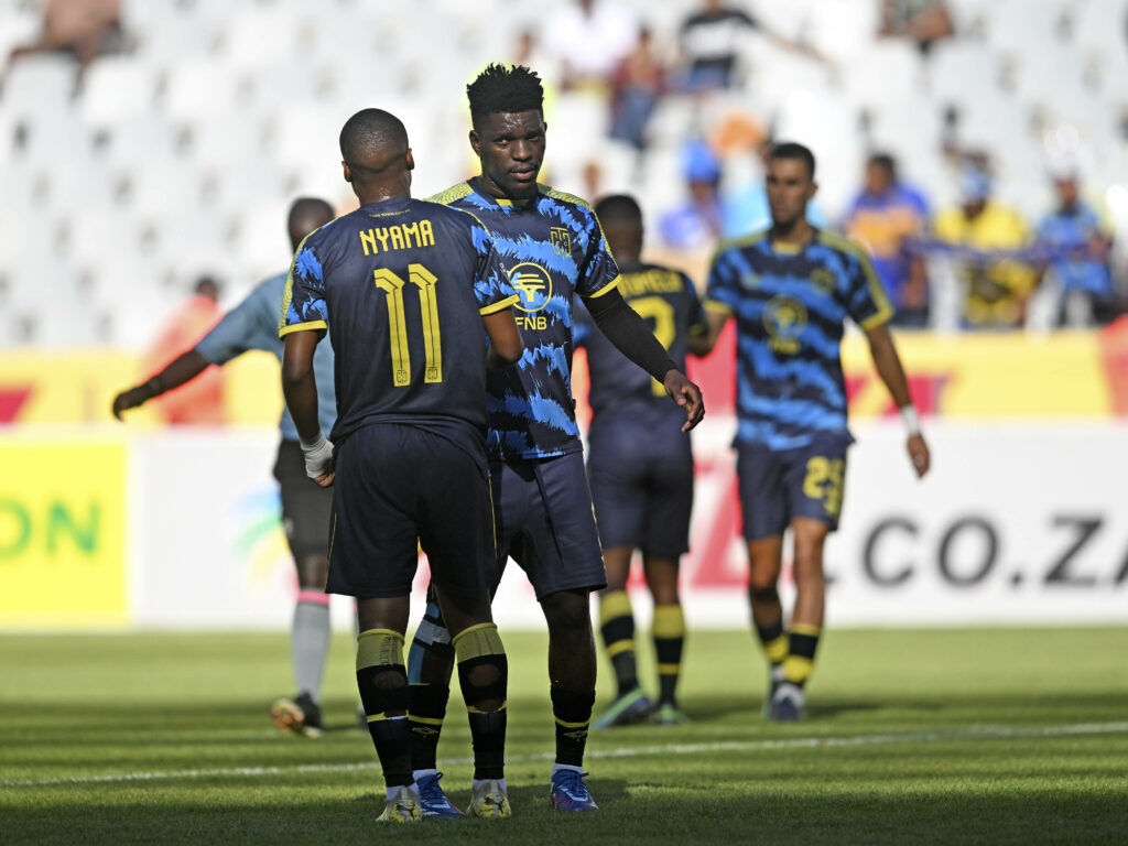 Tshegofatso Nyama and Fidel Brice Ambina of Cape Town City celebrate victory at the final whistle after the DStv Premiership 2023/24 football match between Cape Town Spurs and Cape Town City at Cape Town Stadium