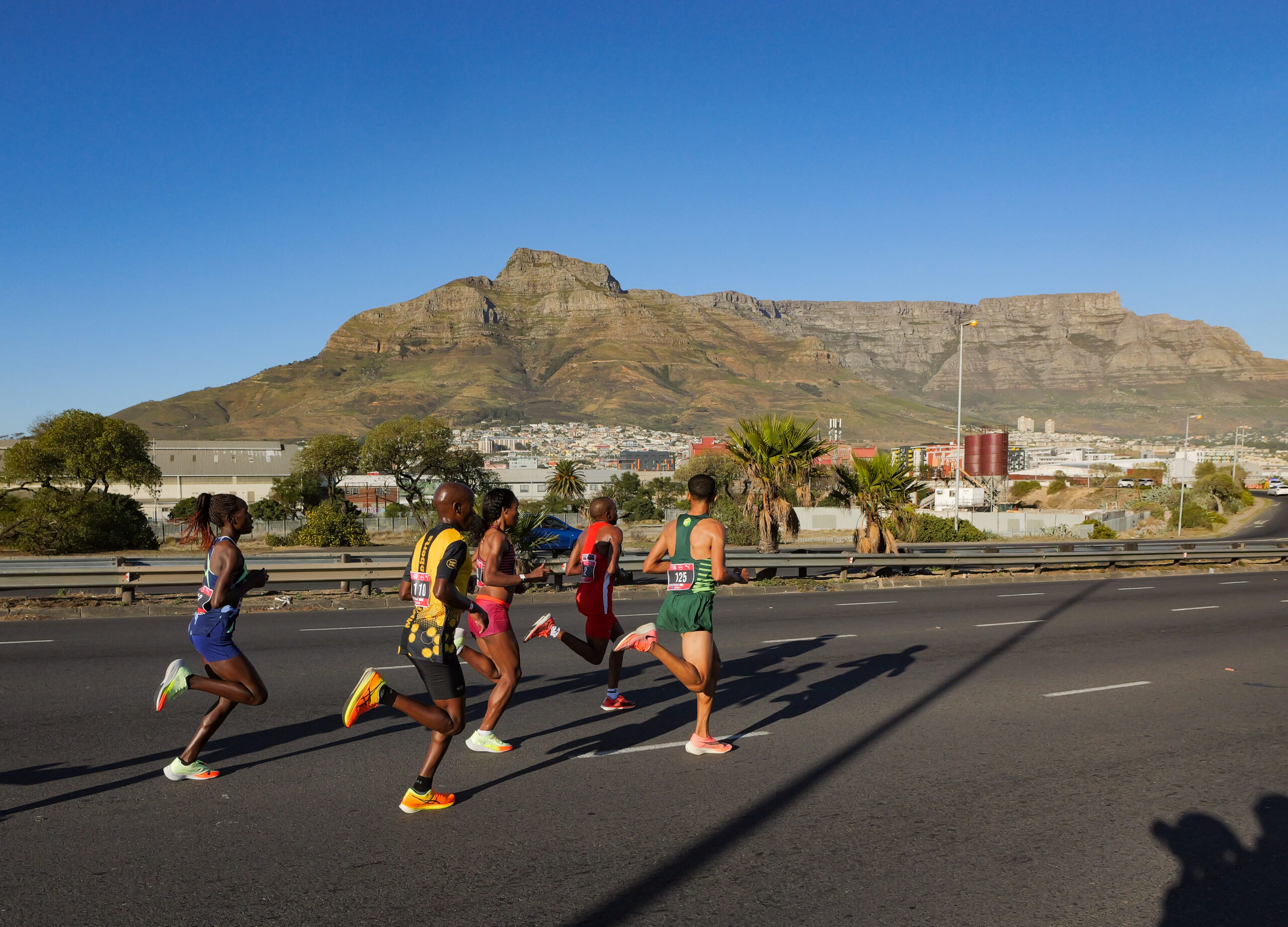 A group of Absa Run Your City Cape Town 10K elite runners on the N1 headed for the CBD