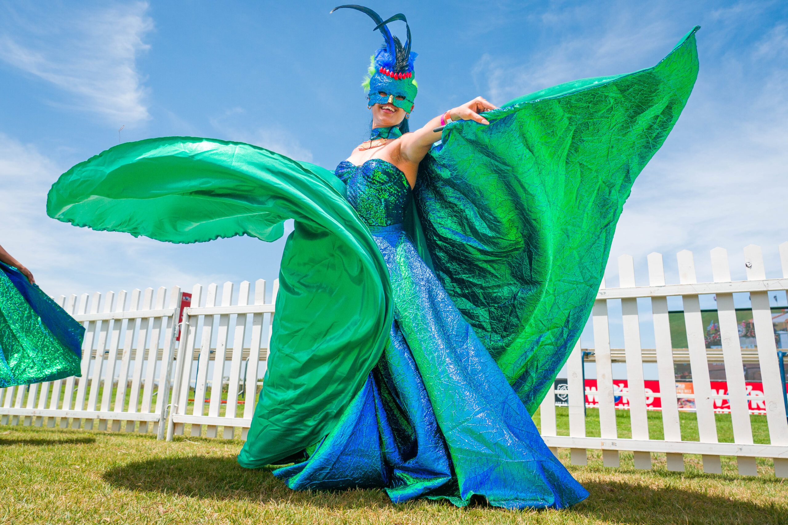 Cape Town MET, attendee in a blue and green dress shows off her outfit.