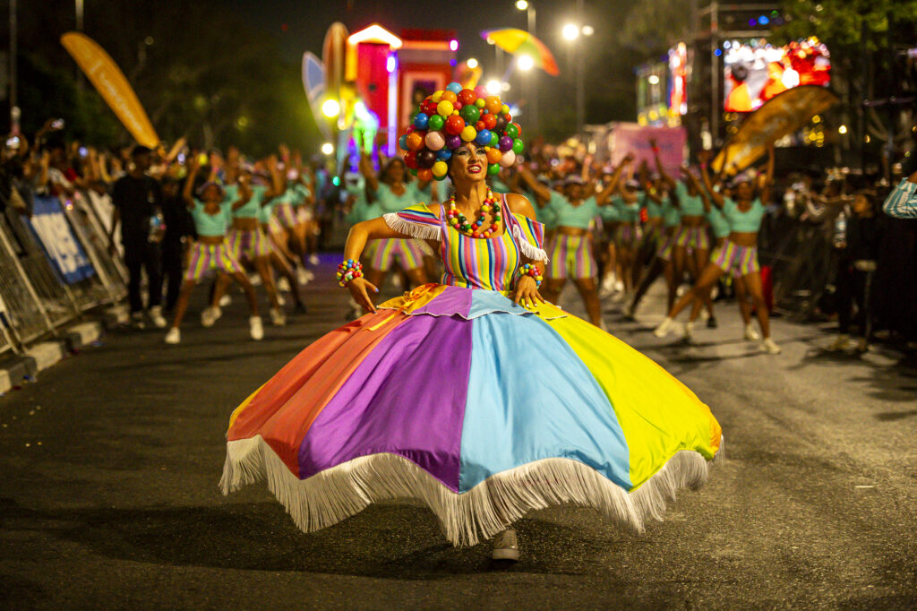 A carnival performer on the parade in 2025